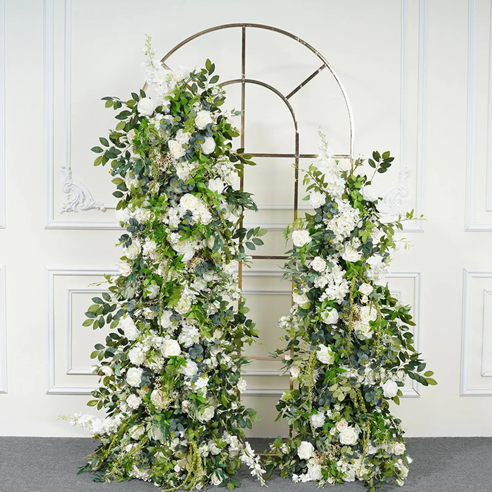 Arch w/ Gate — A floral archway set behind an ornamental gate, so the walk toward the question is part of the design