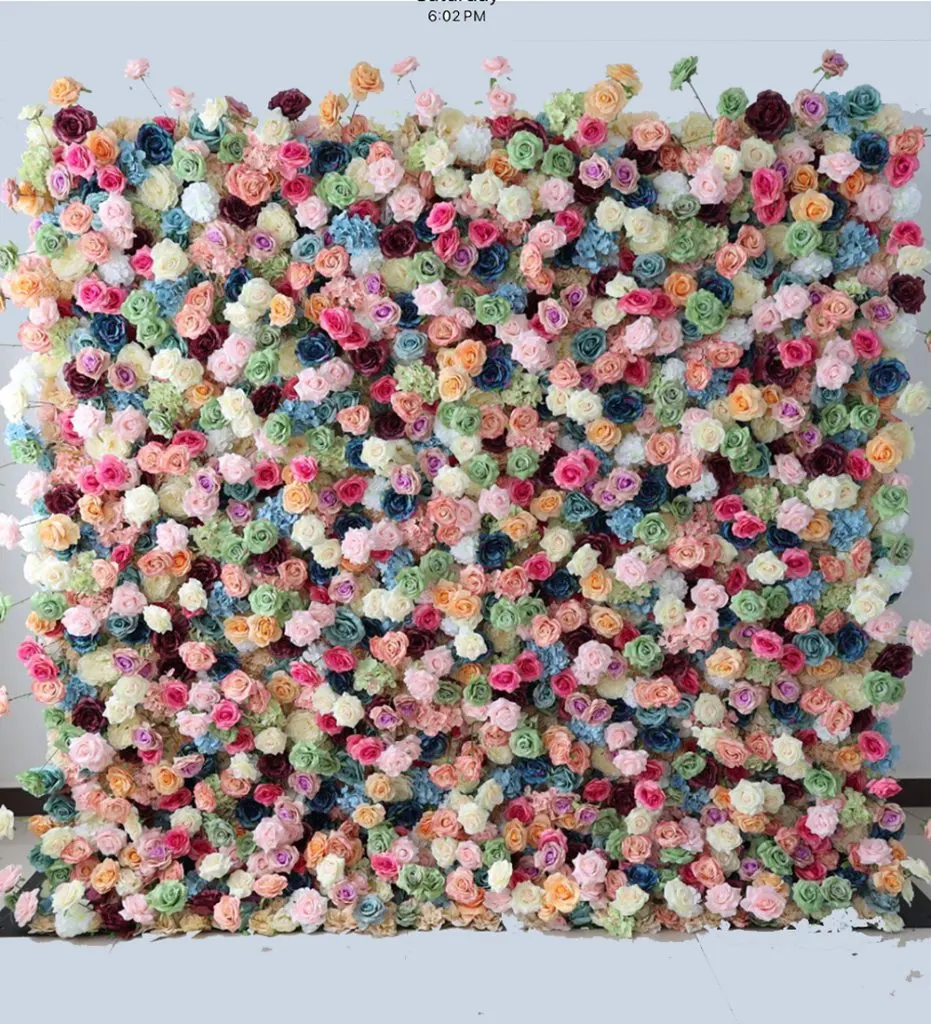 Creamsicle — Create a captivating atmosphere with our beautiful flower wall rental, featuring soft tones of multi-colored roses