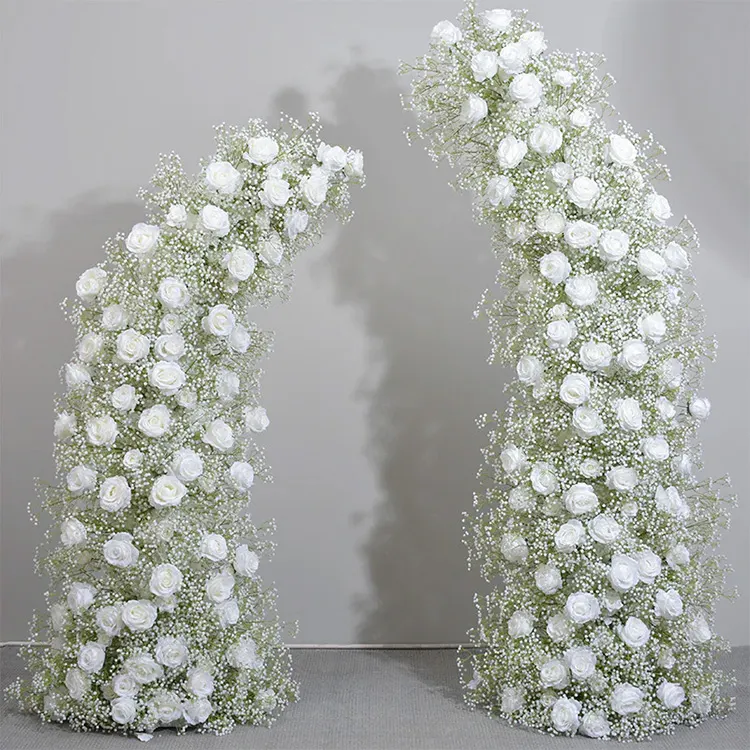 Joy — A white floral archway threaded with baby's breath — delicate, and lovely in evening light