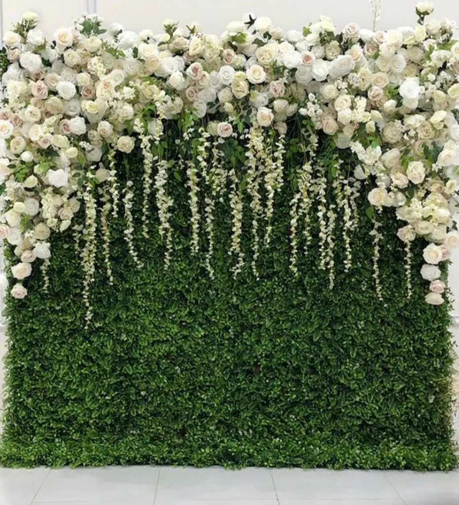 Paradise — Clean white blooms cascade against a stunning greenery backdrop, artfully arranged to make an exquisite statement for your event