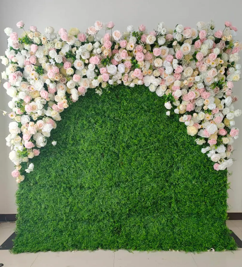 Pink Butterfly Arch — A boxwood green wall crowned with an arch of white and blush roses — fresh, garden-like, and flattering in daylight