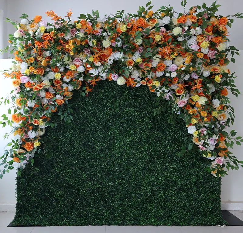 Sunrise — A verdant flower wall adorned with bursts of yellow, orange, and pink petals creates a lively and cheerful ambiance, radiating warmth